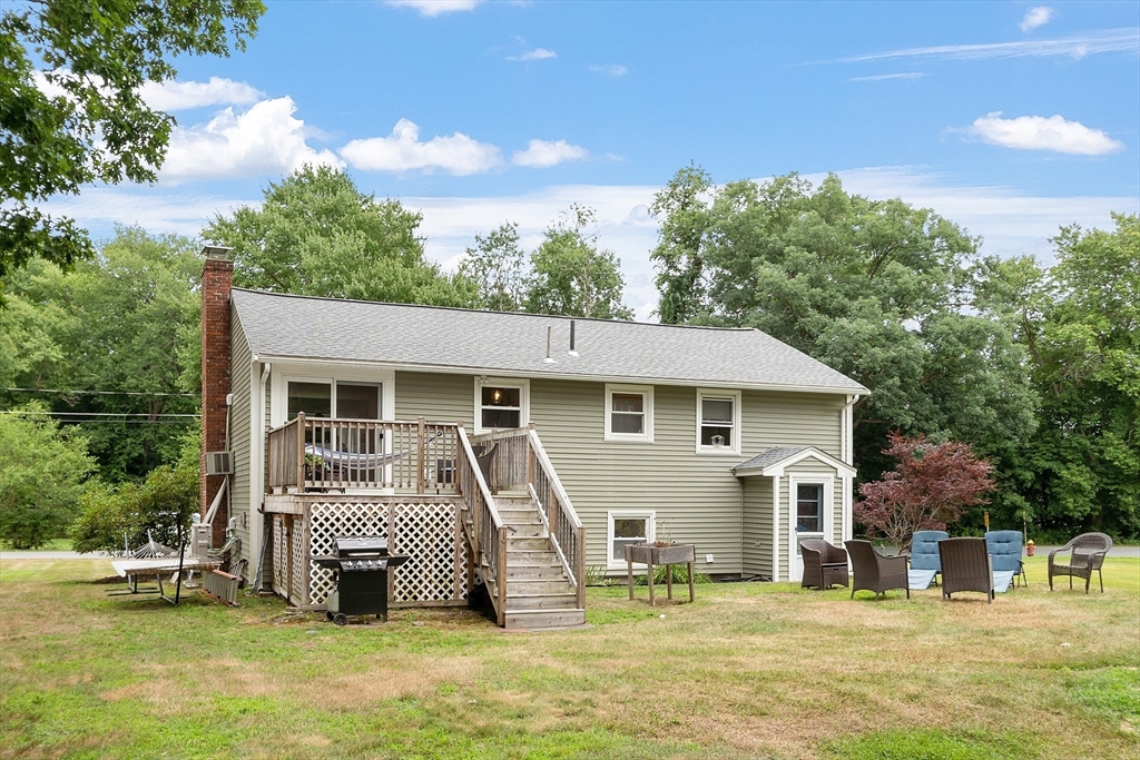 9 Springwell Road Billerica, MA 01821 - Photo 33 of 37 a front view of a house with a yard