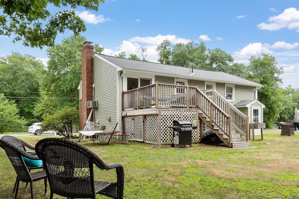 9 Springwell Road Billerica, MA 01821 - Photo 34 of 37 a view of a house with backyard and sitting area