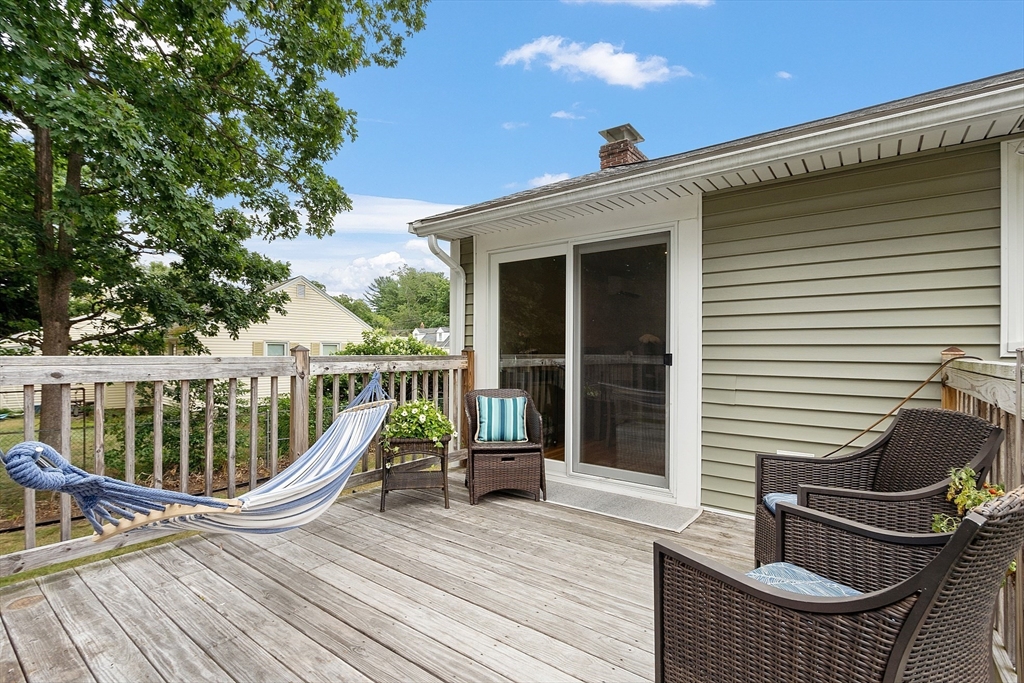 9 Springwell Road Billerica, MA 01821 - Photo 36 of 37 a view of a roof deck with wooden floor and fence