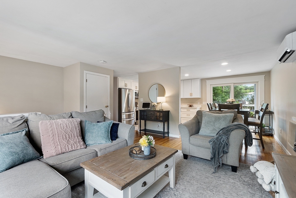 9 Springwell Road Billerica, MA 01821 - Photo 5 of 37 a living room with furniture and a table