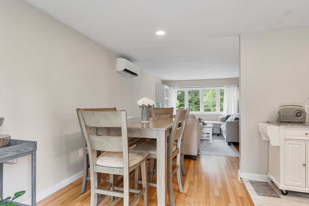 9 Springwell Road Billerica, MA 01821 - Photo 9 of 37 a dining room with furniture and wooden floor