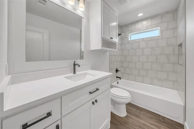 a bathroom with a sink a toilet and a bathtub