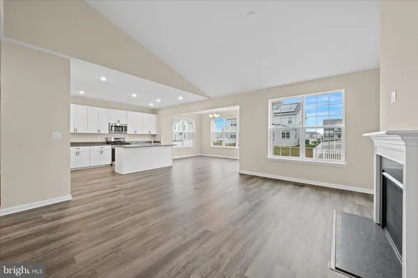 a view of kitchen with furniture and wooden floor