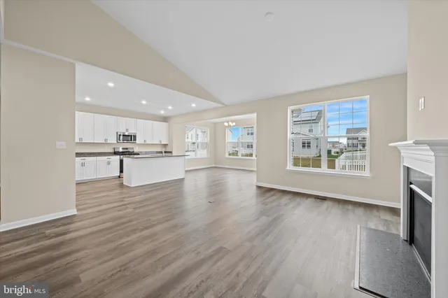 a view of kitchen with furniture and wooden floor