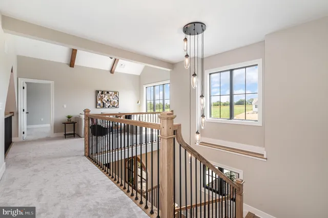 an empty room with closet and windows