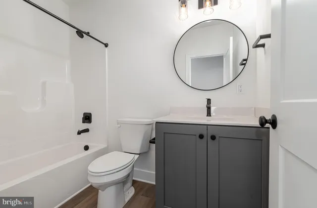 a picture of a bathroom with a shower