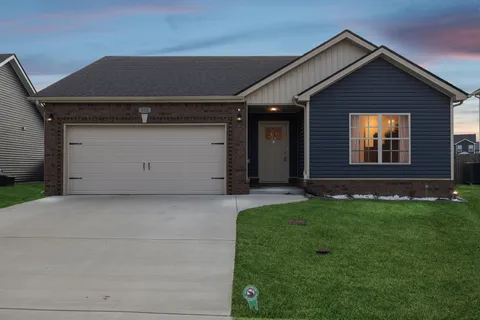 a front view of a house with a garage