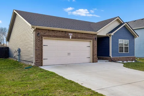 a front view of a house with a garage