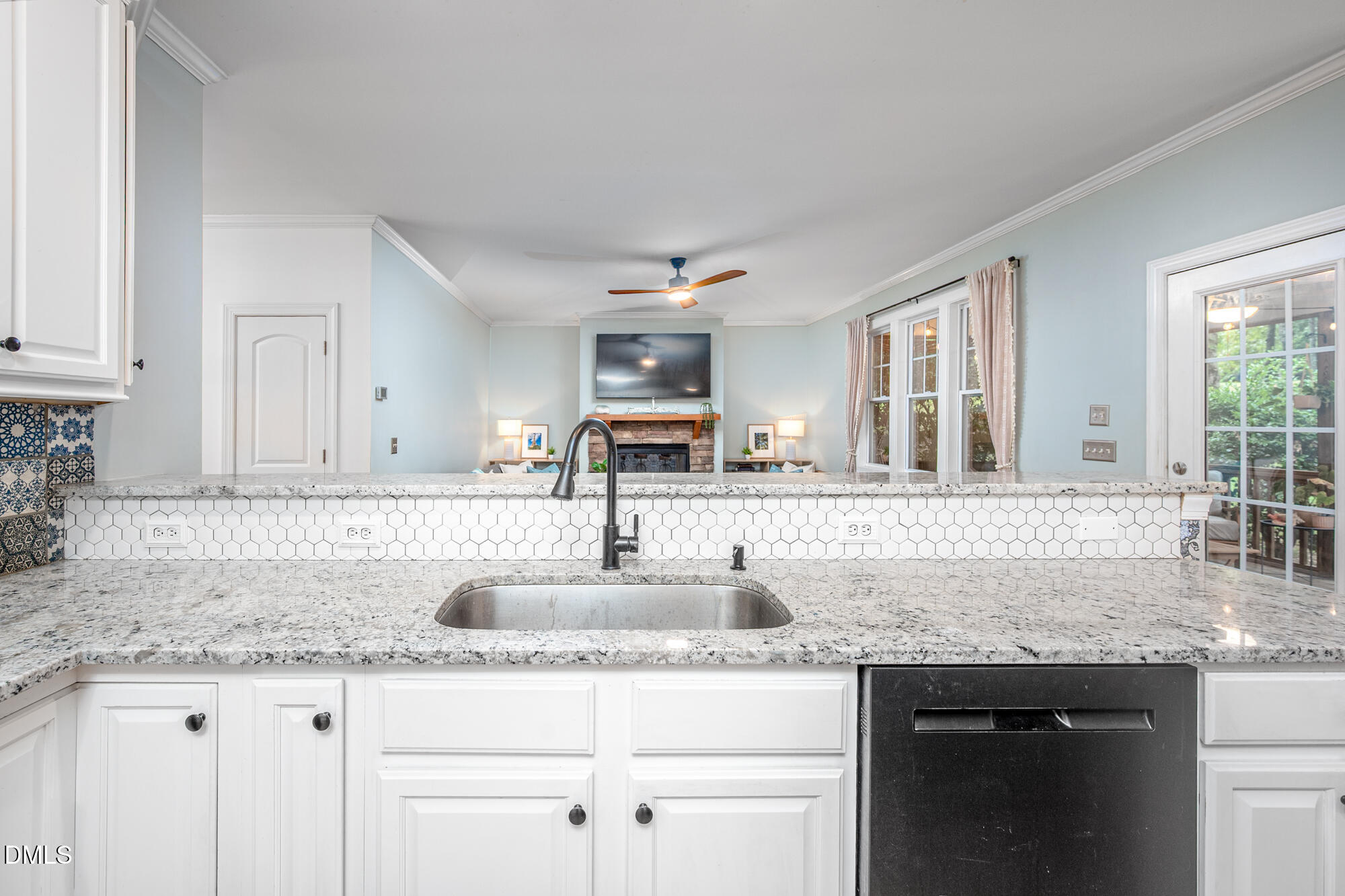 726 Ruth Circle Fuquay-Varina, NC 27526 - Photo 17 of 61 a kitchen with granite countertop kitchen island a sink appliances and a counter space