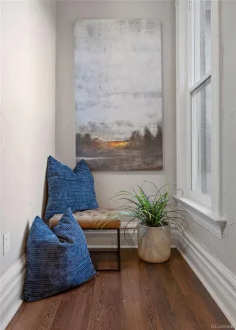 a white couch sitting next to a window