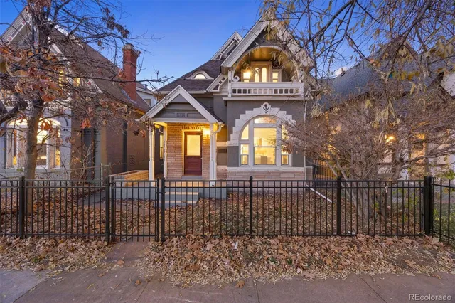a view of a brick house with a large windows