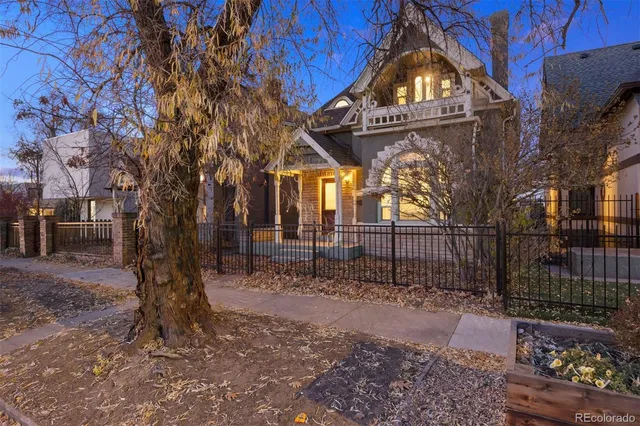 a view of a pathway with a wrought fence