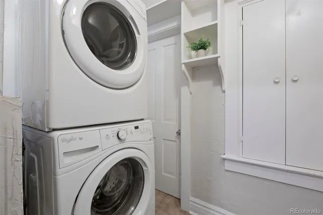 a view of a hallway with washer and dryer