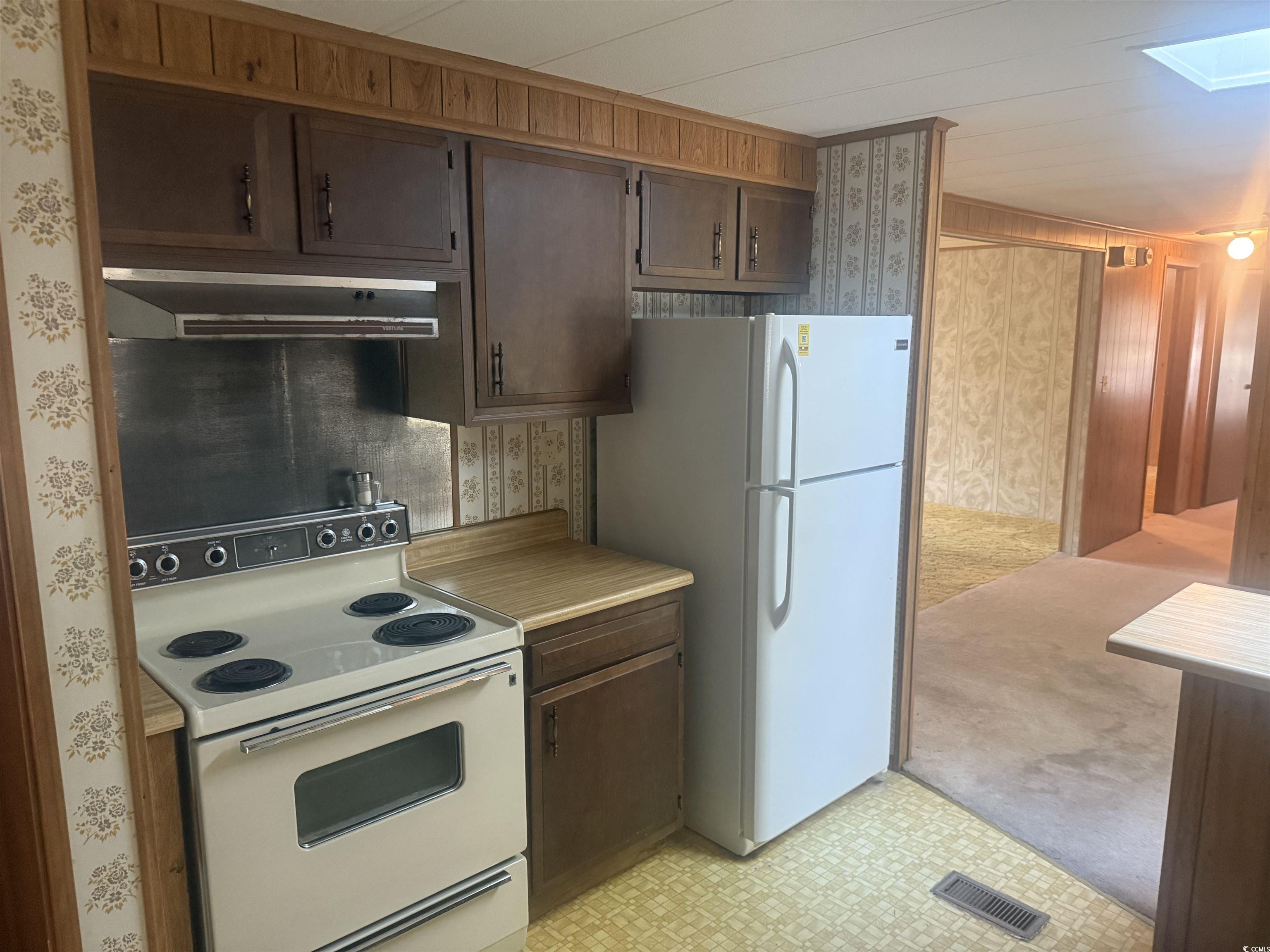 712 Raleigh Trail Murrells Inlet, SC 29576 - Photo 13 of 32 Empty room featuring a ceiling fan, carpet, and a textured ceiling