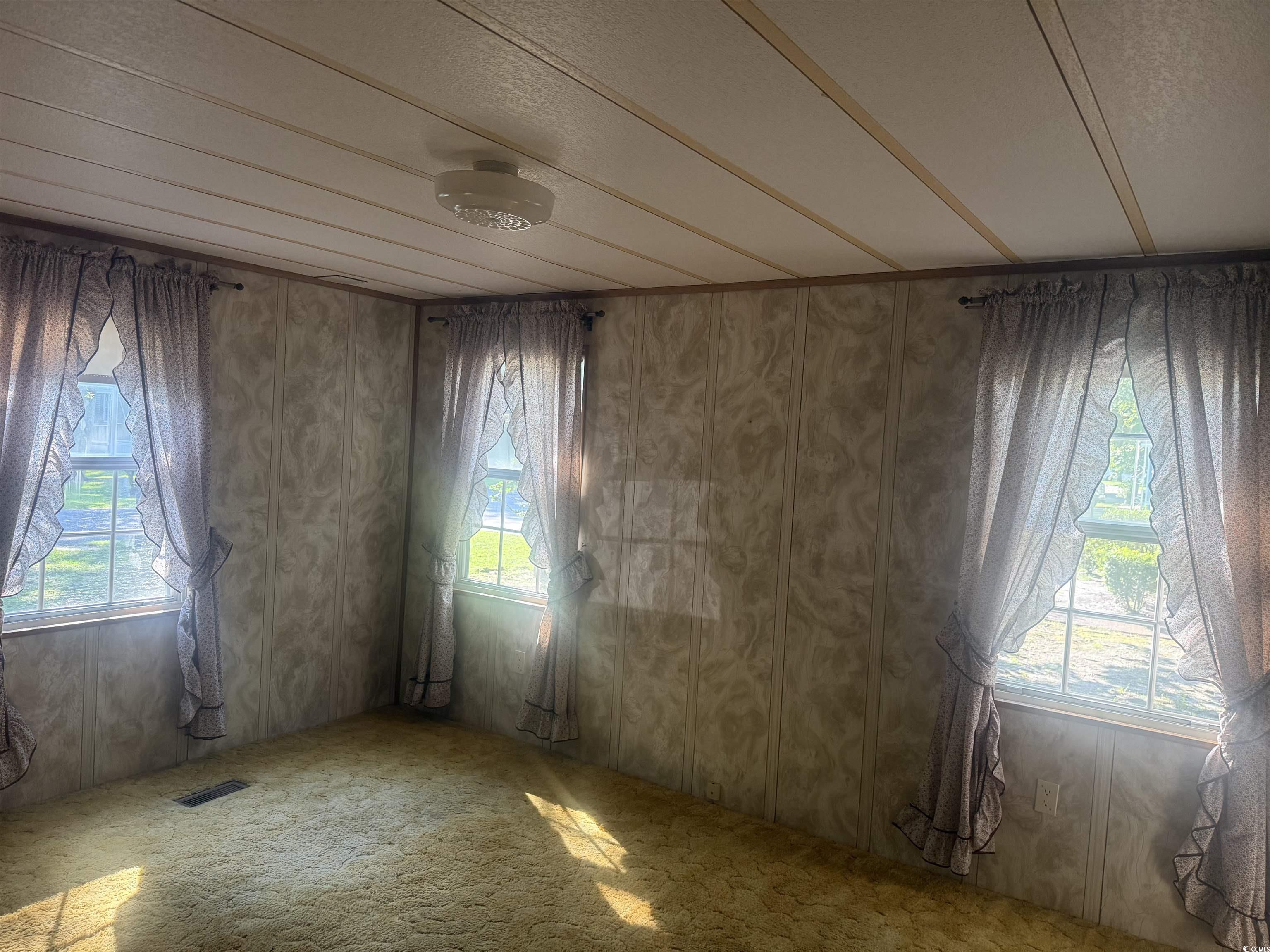 712 Raleigh Trail Murrells Inlet, SC 29576 - Photo 16 of 32 Kitchen featuring a peninsula, white appliances, and light countertops