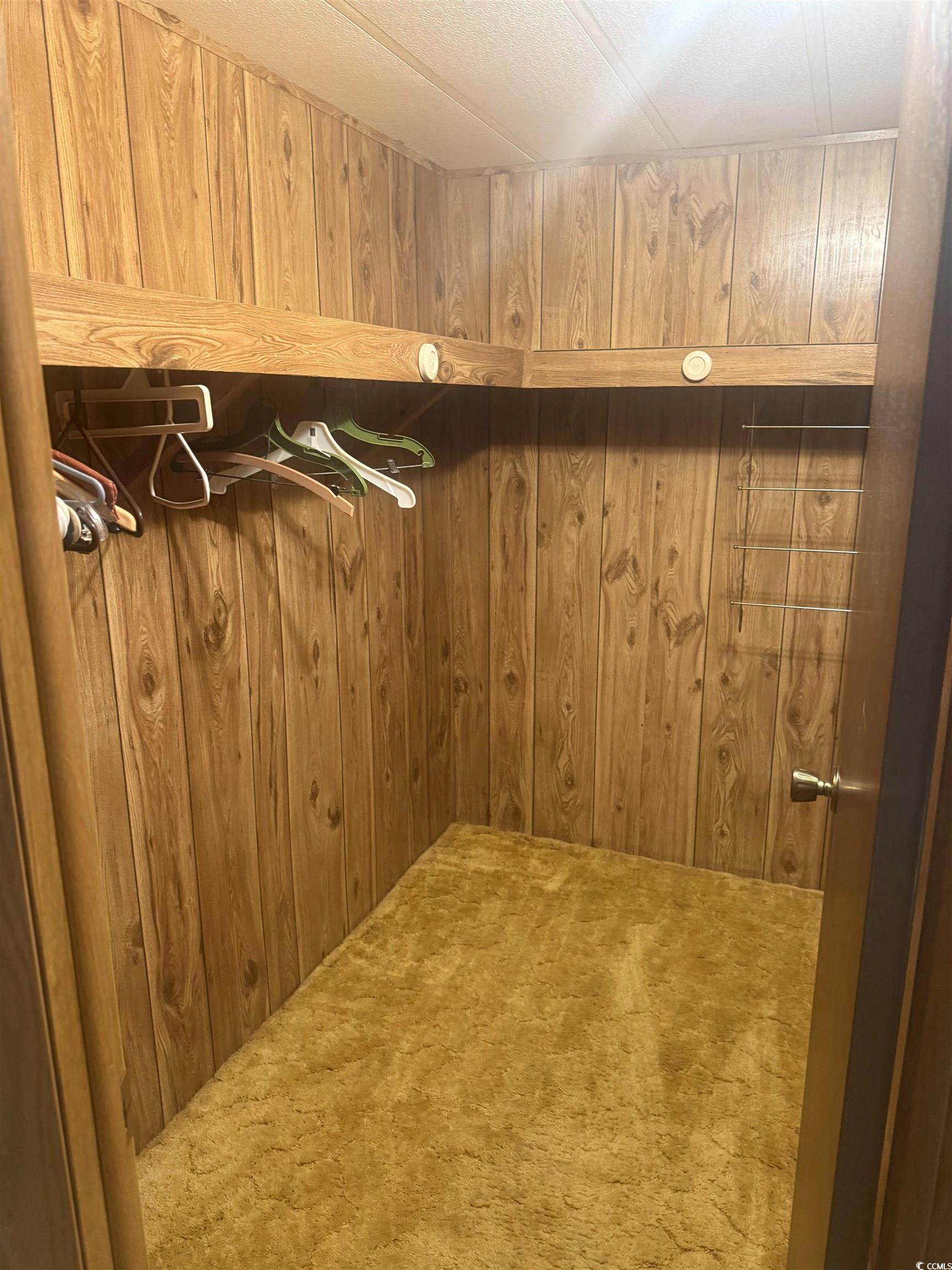 712 Raleigh Trail Murrells Inlet, SC 29576 - Photo 19 of 32 Full bath featuring double vanity, wallpapered walls, and light wood-style flooring