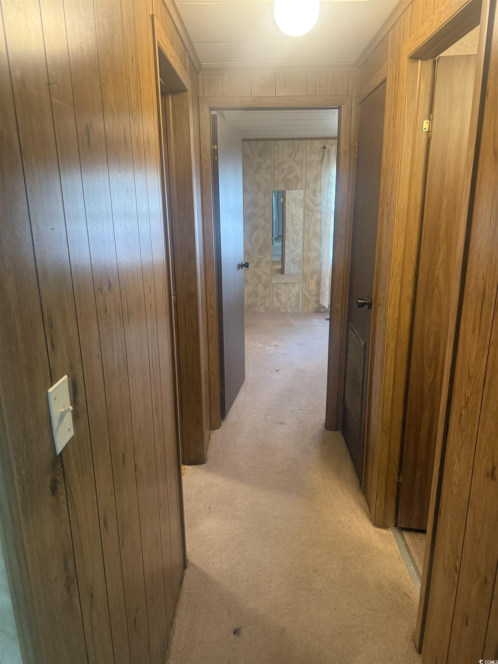 712 Raleigh Trail Murrells Inlet, SC 29576 - Photo 20 of 32 Full bathroom featuring wallpapered walls, a stall shower, ornamental molding, and dark wood-type flooring