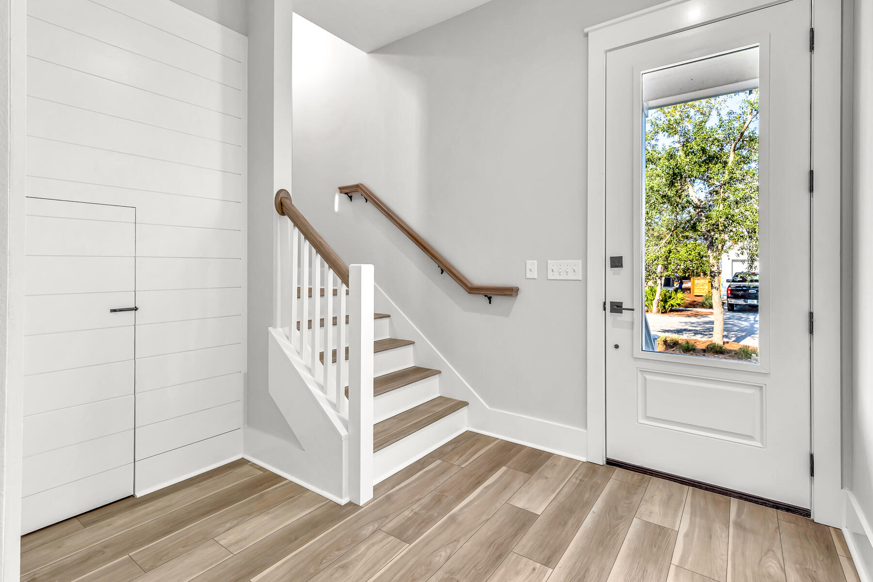 106 Marlberry Santa Rosa Beach Santa Rosa Beach, FL 32459 - Photo 6 of 37 a view of a hallway with wooden floor and staircase
