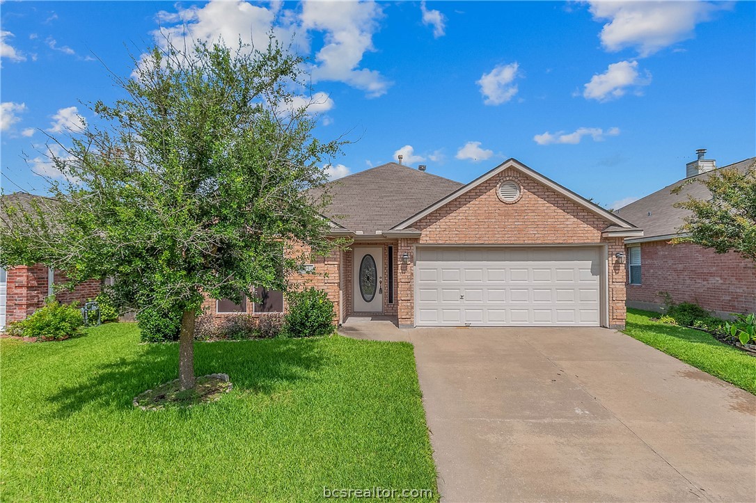 2631 Trophy Drive Bryan, TX 77802 - Photo 1 of 1 a front view of house with yard and green space