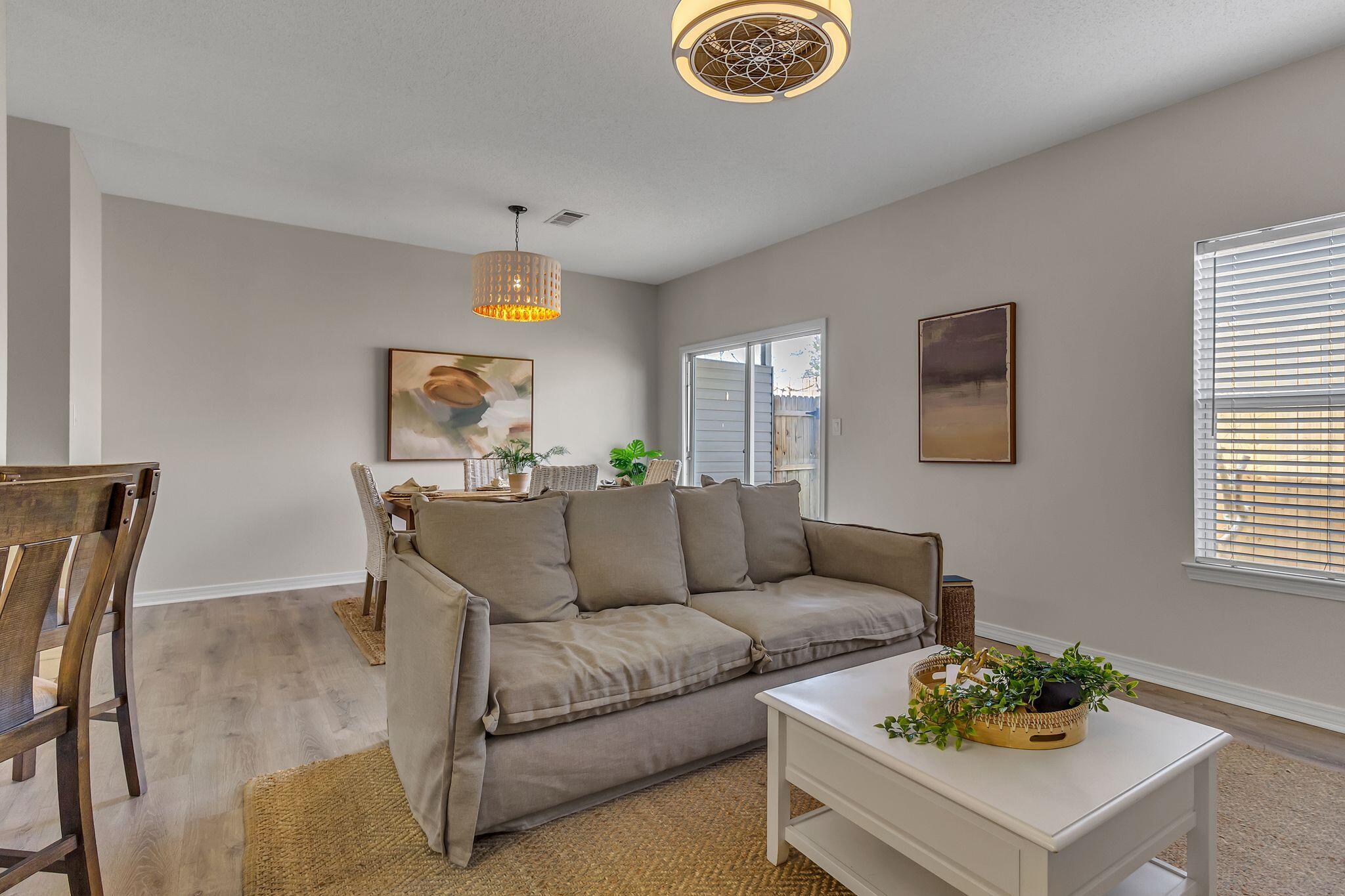 150 Bent Arrow Drive, Unit 51 Destin, FL 32541 - Photo 5 of 28 a living room with furniture and a window