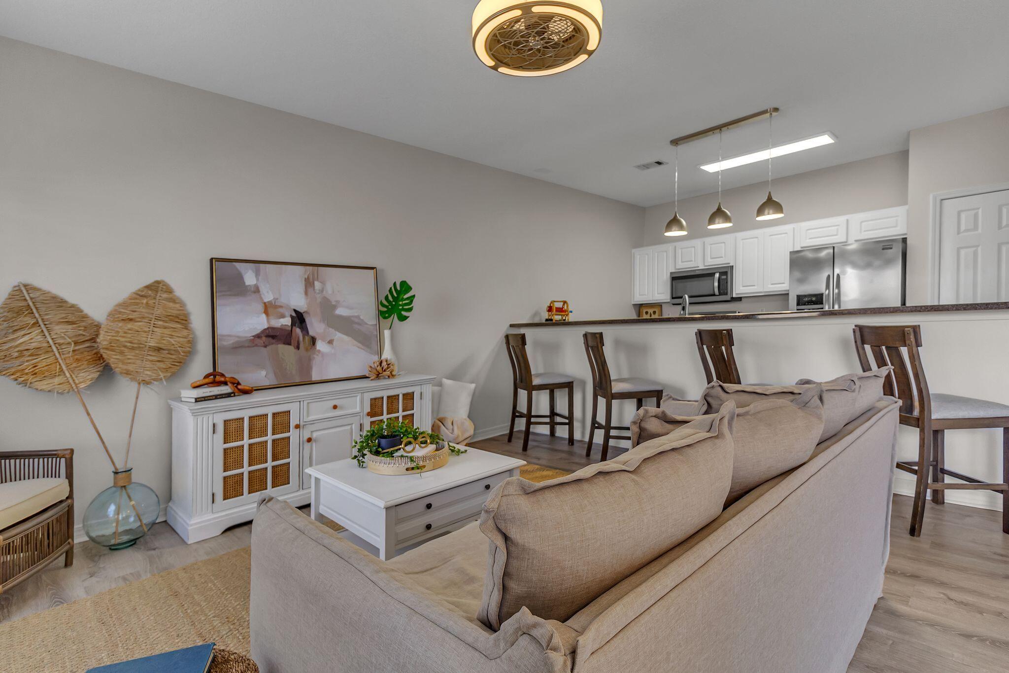 150 Bent Arrow Drive, Unit 51 Destin, FL 32541 - Photo 6 of 28 a living room with furniture and a table