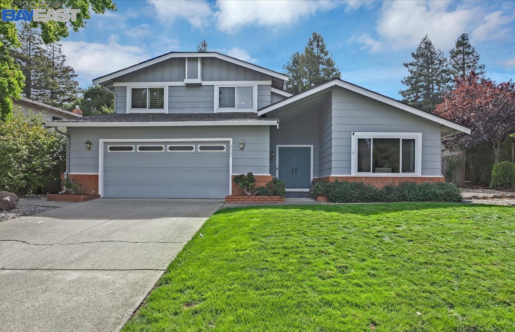 2503 Paddock Drive San Ramon, CA 94583 - Photo 1 of 1 a front view of a house with a yard and garage