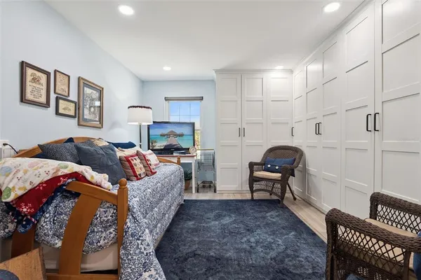 a living room with furniture and a book shelf