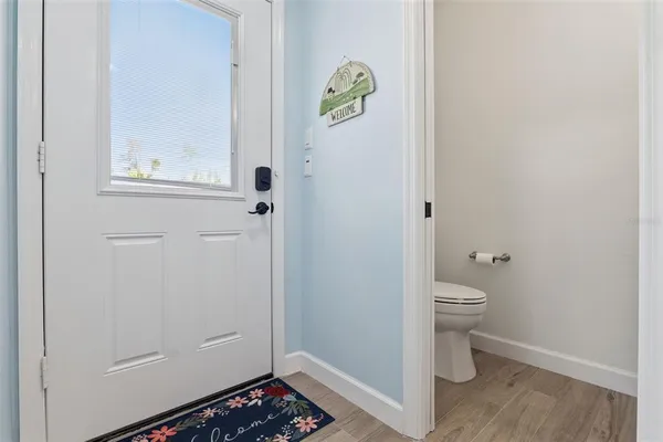 a kitchen with refrigerator and window