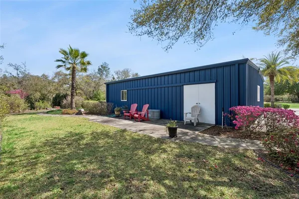 an aerial view of a house with outdoor space
