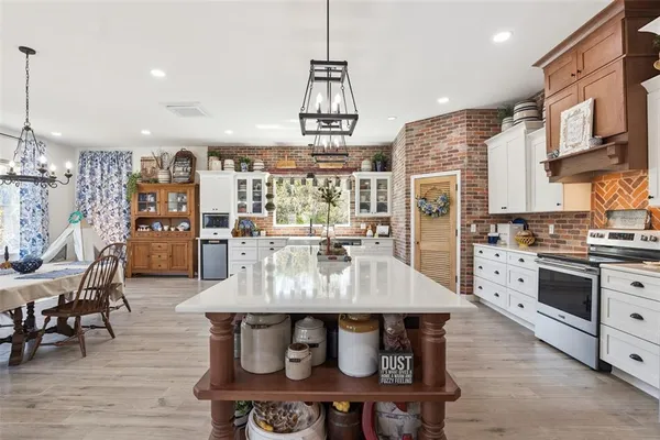 a kitchen with stainless steel appliances a stove and a refrigerator