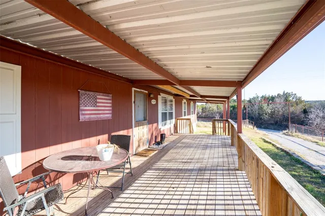 a view of a swimming pool with an outdoor seating