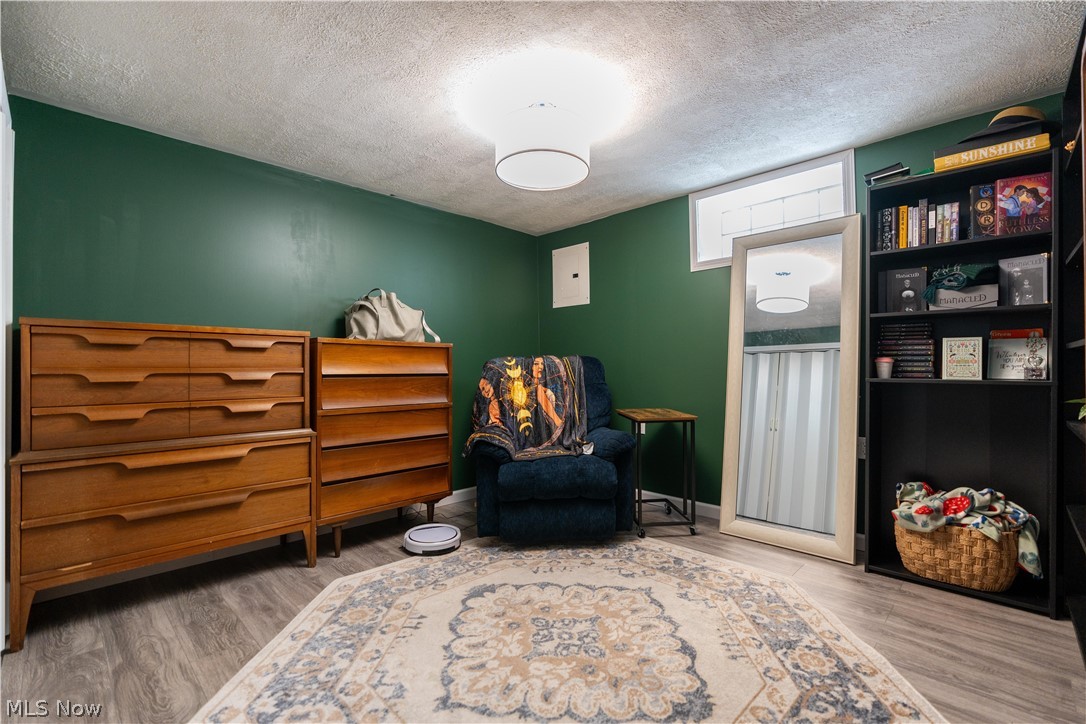 8320 Ackley Road Parma, OH 44129 - Photo 21 of 36 Sitting room with a textured ceiling and hardwood / wood-style flooring