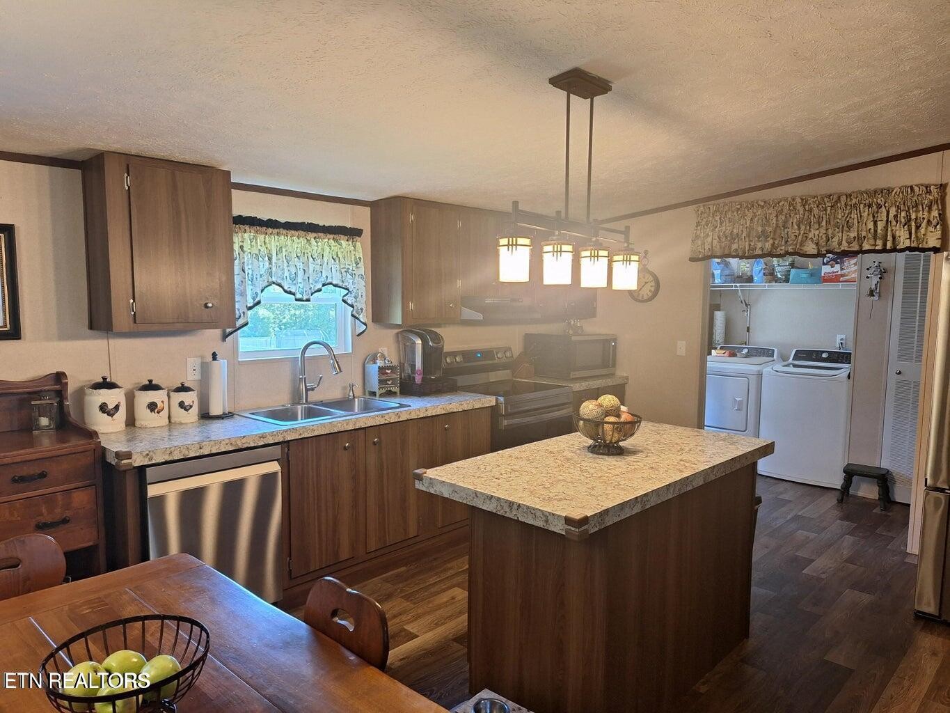1450 Belltown Road Tellico Plains, TN 37385 - Photo 27 of 32 a kitchen with sink cabinets and wooden floor