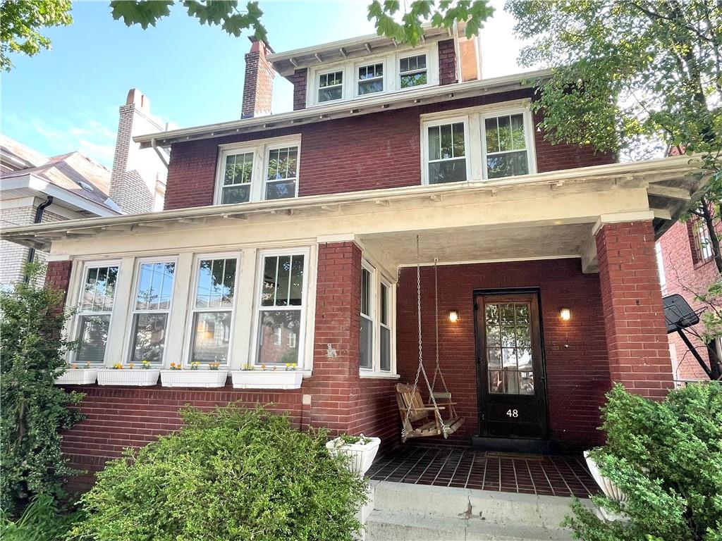 48 Perry View Avenue Pittsburgh, PA 15214 - Photo 1 of 24 front view of a brick house with a large windows