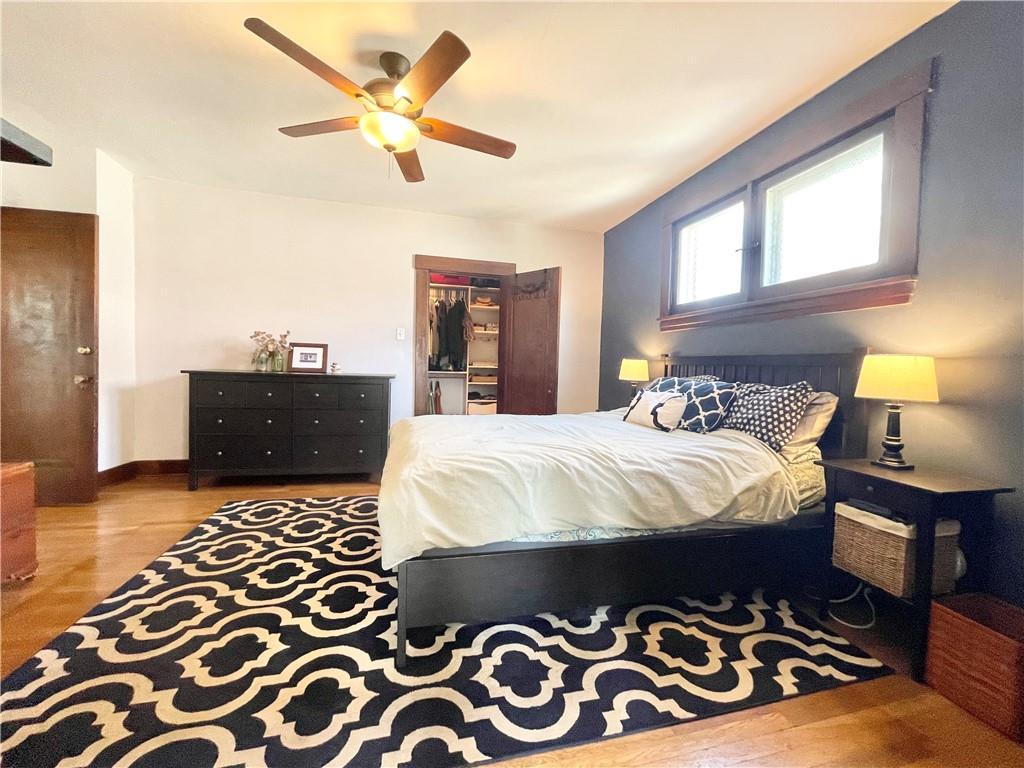 48 Perry View Avenue Pittsburgh, PA 15214 - Photo 12 of 24 a bedroom with a bed and wooden floor