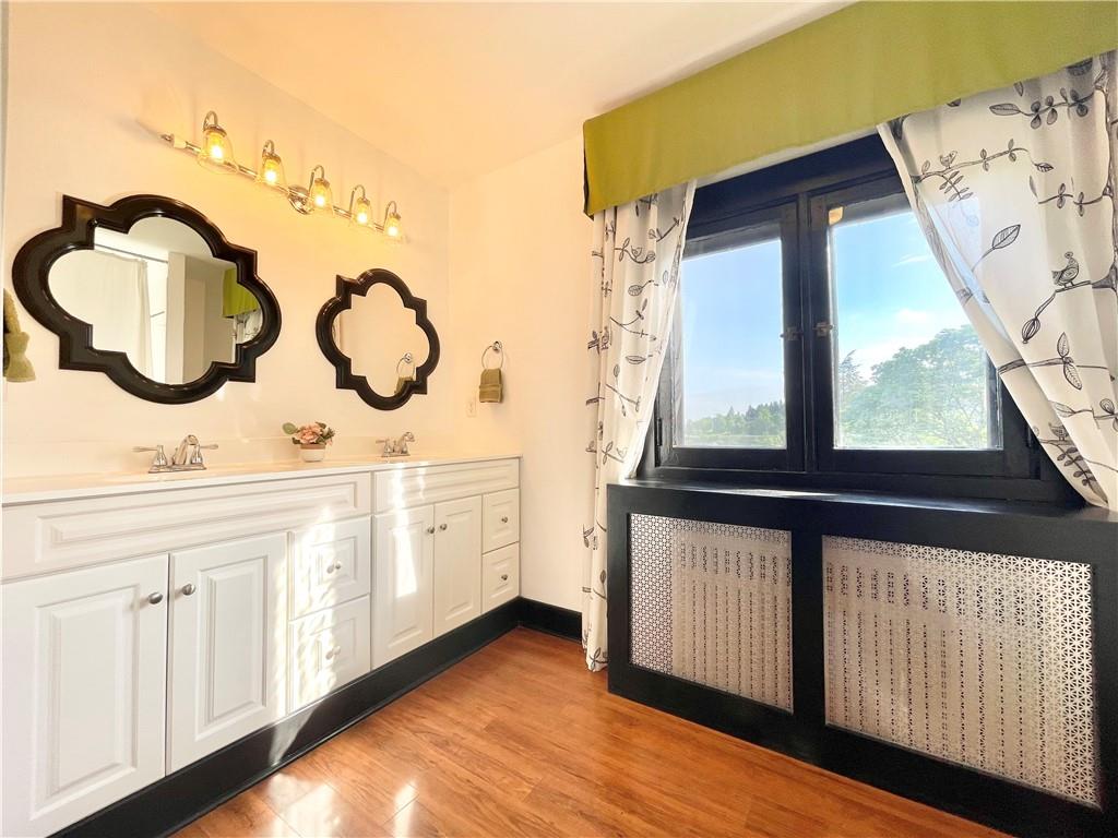 48 Perry View Avenue Pittsburgh, PA 15214 - Photo 14 of 24 a bathroom with a sink and a mirror