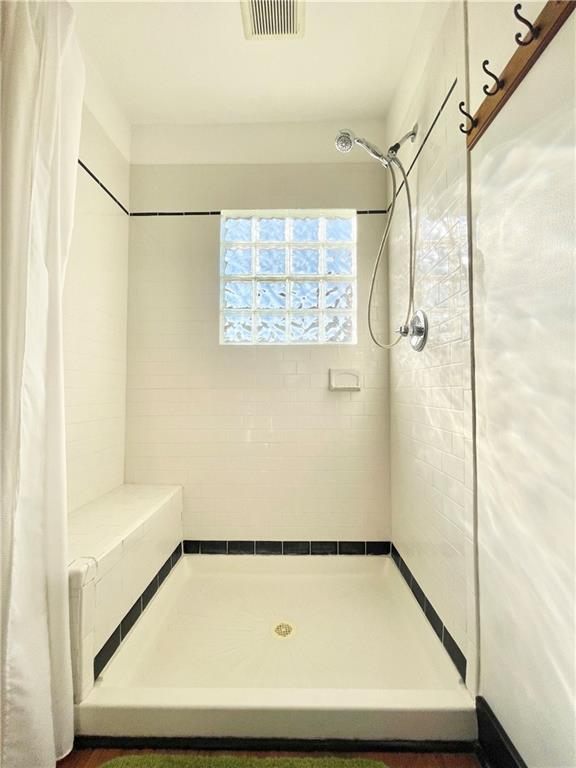 48 Perry View Avenue Pittsburgh, PA 15214 - Photo 15 of 24 a bathroom with a shower and a bathtub