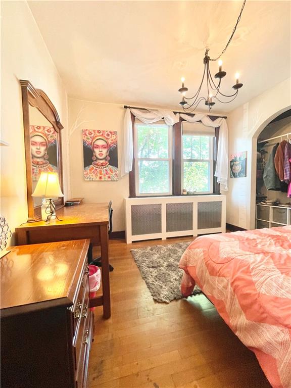 48 Perry View Avenue Pittsburgh, PA 15214 - Photo 17 of 24 a spacious bedroom with a bed a dresser next to a window