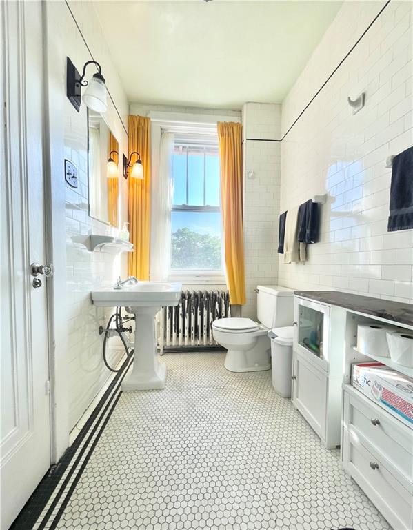 48 Perry View Avenue Pittsburgh, PA 15214 - Photo 18 of 24 a bathroom with a granite countertop double vanity sink a mirror and a shower