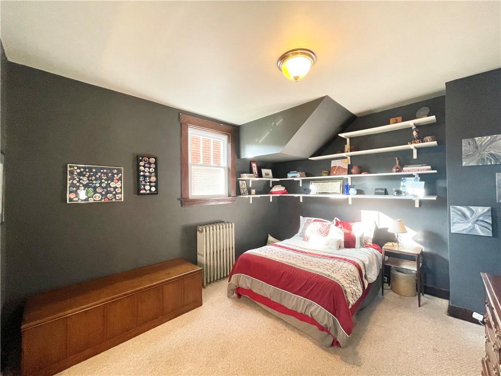 48 Perry View Avenue Pittsburgh, PA 15214 - Photo 9 of 24 a bedroom with a bed and a window