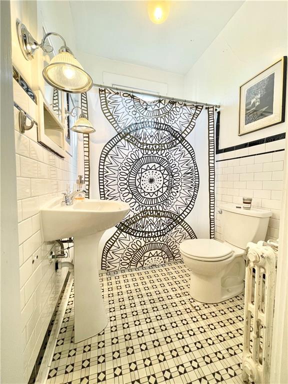 48 Perry View Avenue Pittsburgh, PA 15214 - Photo 10 of 24 a bathroom with a sink toilet and shower