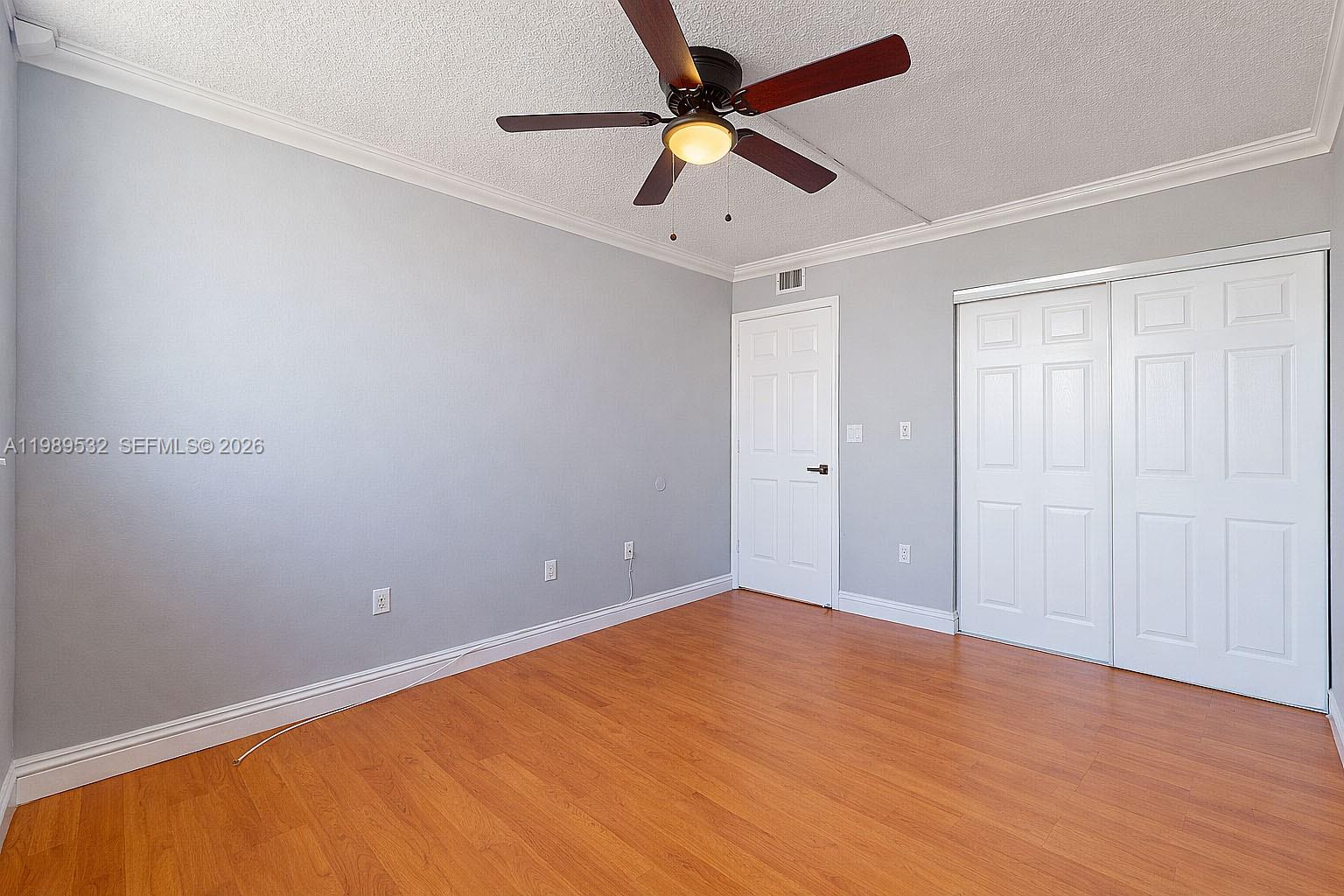 3581 Southwest 117th Avenue, Unit 5308 Miami, FL 33165 - Photo 24 of 38 an empty room with a window and a fan