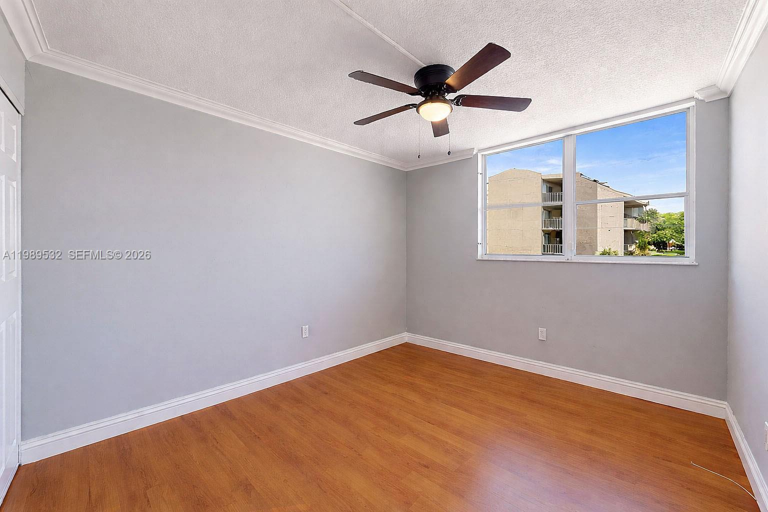3581 Southwest 117th Avenue, Unit 5308 Miami, FL 33165 - Photo 25 of 38 an empty room with a window and a fan