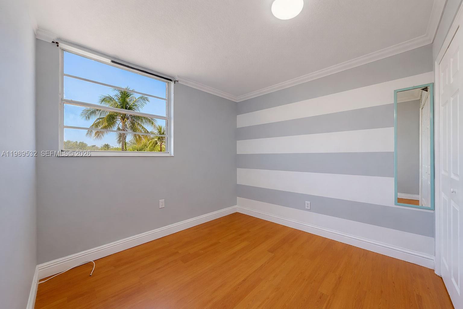 3581 Southwest 117th Avenue, Unit 5308 Miami, FL 33165 - Photo 29 of 38 a view of an empty room with a window