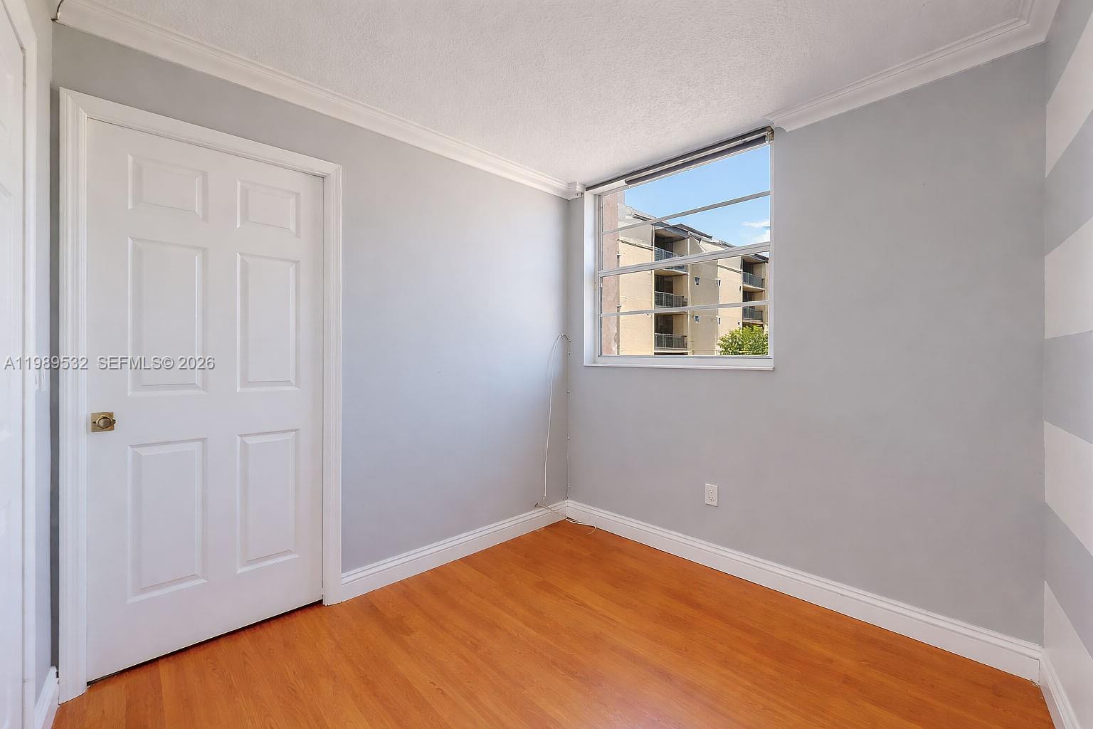 3581 Southwest 117th Avenue, Unit 5308 Miami, FL 33165 - Photo 30 of 38 a view of an empty room with a window