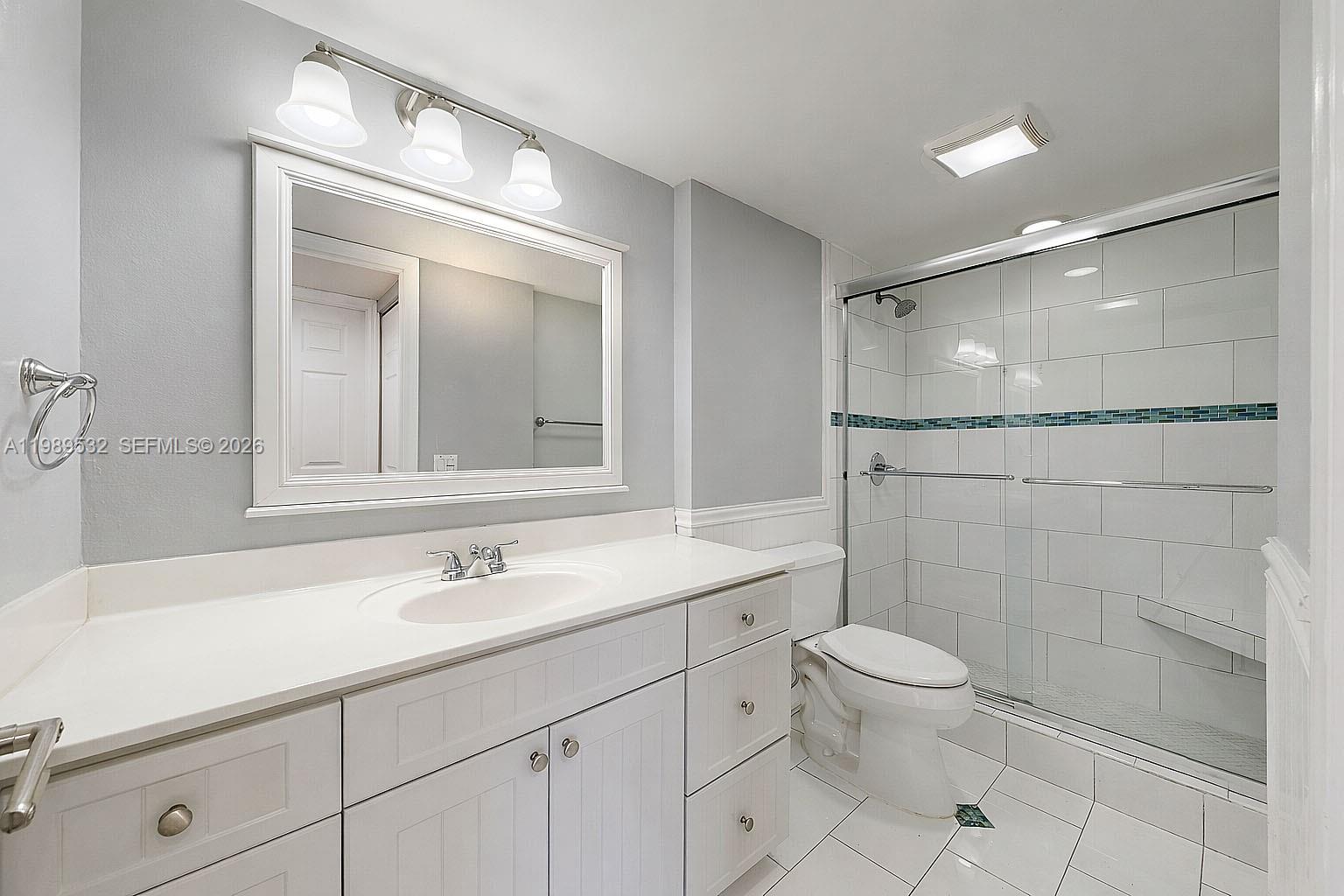 3581 Southwest 117th Avenue, Unit 5308 Miami, FL 33165 - Photo 33 of 38 a bathroom with a sink a toilet and shower