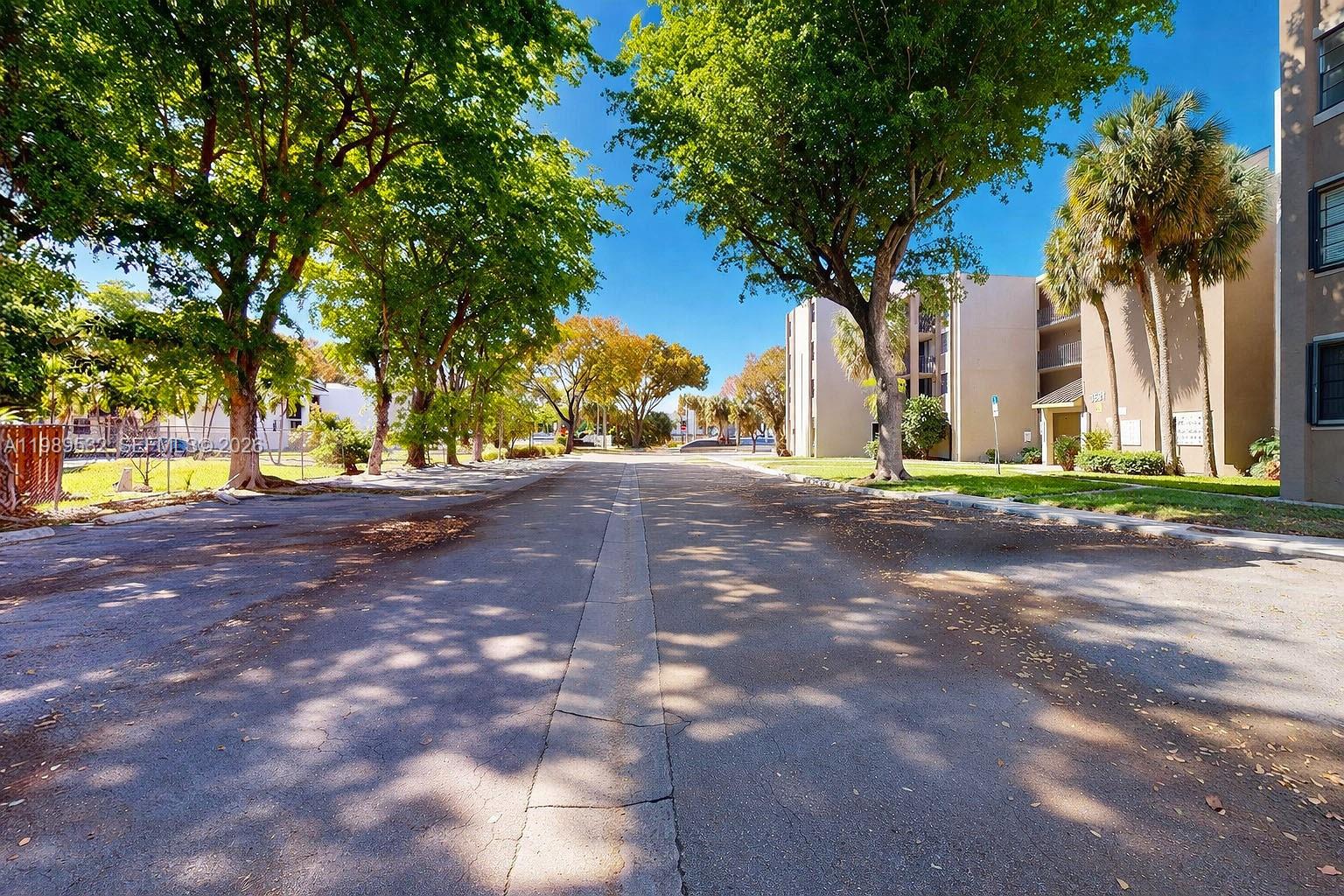 3581 Southwest 117th Avenue, Unit 5308 Miami, FL 33165 - Photo 4 of 38 a view of road with trees