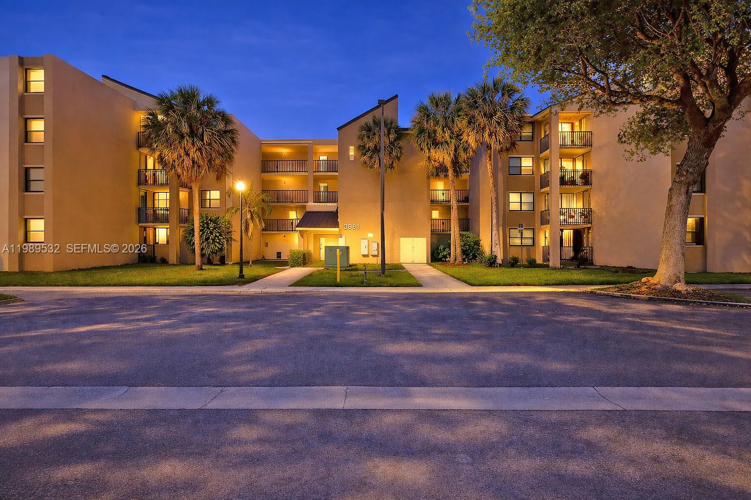 3581 Southwest 117th Avenue, Unit 5308 Miami, FL 33165 - Photo 7 of 38 a view of road with large trees