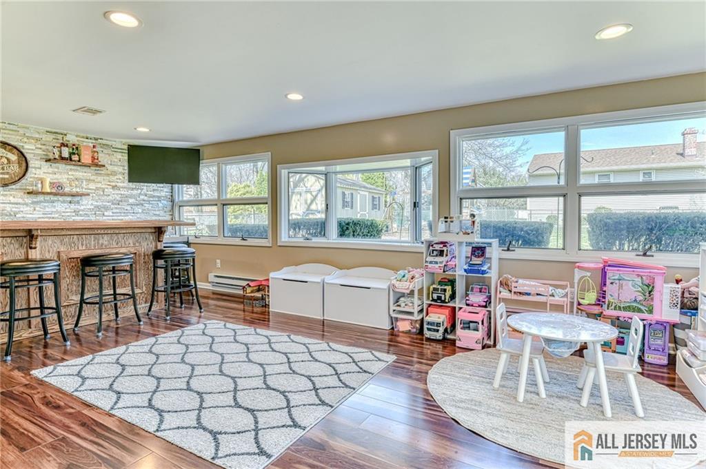 35 Outcalt Road Edison, NJ 08817 - Photo 16 of 33 a living room with furniture a table and a large window