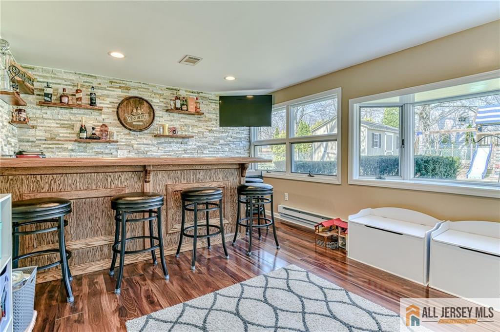 35 Outcalt Road Edison, NJ 08817 - Photo 17 of 33 a living room with a table and chairs